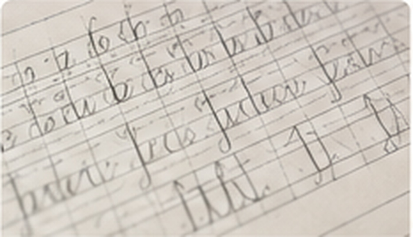 Detailed calligraphy lettering practice on paper